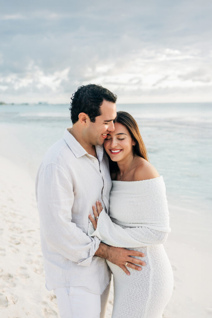 Expecting parents together on a Grand Cayman beach