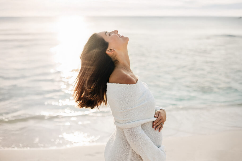Expecting parents together on a Grand Cayman beach